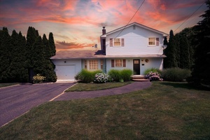 Welcome to 75 Head of the Neck Road in Bellport, a truly private and meticulously kept home.