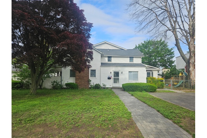 View of front of home with a playground