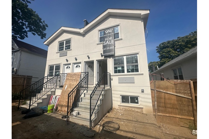 View of front of house featuring stucco siding