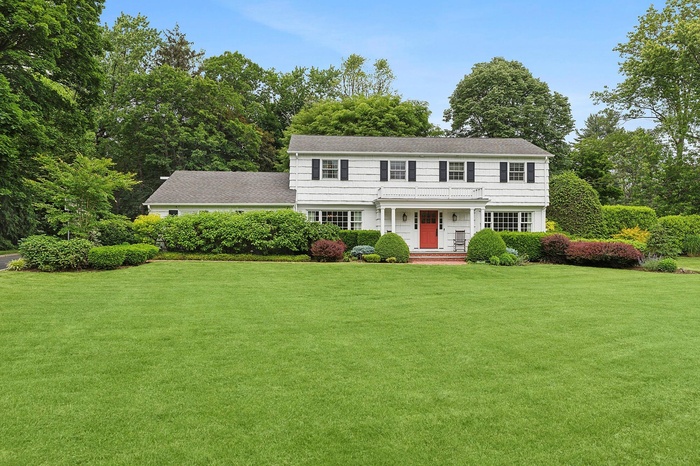 Colonial house with a front yard