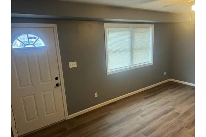 Foyer with wood finished floors and ceiling fan
