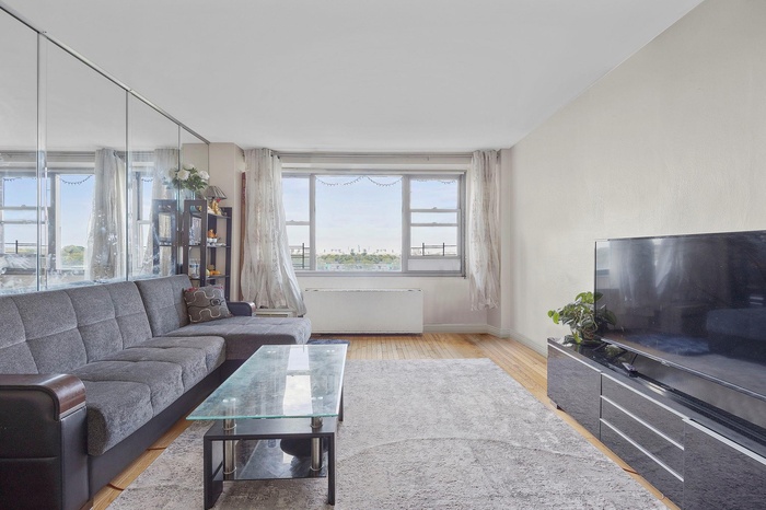 Living room with baseboards and wood finished floors