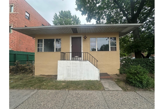 View of front of property featuring stucco siding