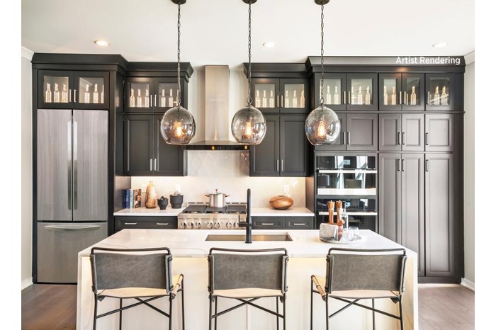 Kitchen featuring a breakfast bar, sink, exhaust hood, a center island with sink, and stainless steel built in fridge