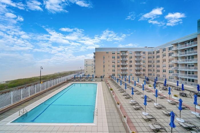 View of boardwalk and pool from unit balcony