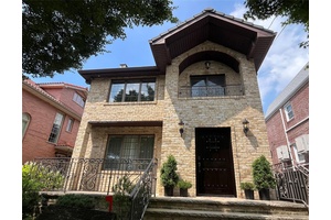 Welcome to this Exquisitely Designed Two Family Home This beautifully appointed two family residence masterfully blends timeless elegance with modern functionality.