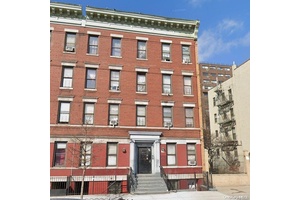 Brick Multi family property with a total of 9 units including a 2 bedroom basement apartment.