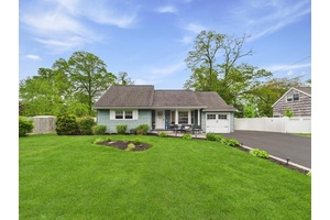 Discover this beautifully renovated expanded cape located in the sought after South Oakdale neighborhood.