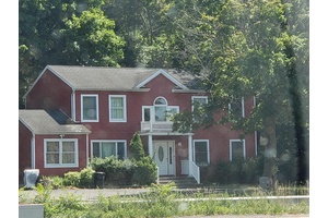 Spacious Colonial home located in the heart of Lake Grove within the Three Village School District.