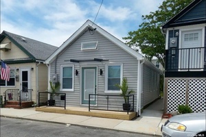 This Beautiful Bungalow was Recently Renovated and Features an Open Concept Living Area, Modern Bath, 2 Bedrooms and Sliders to the Deck w Access to a Landscaped Backyard w Large ...