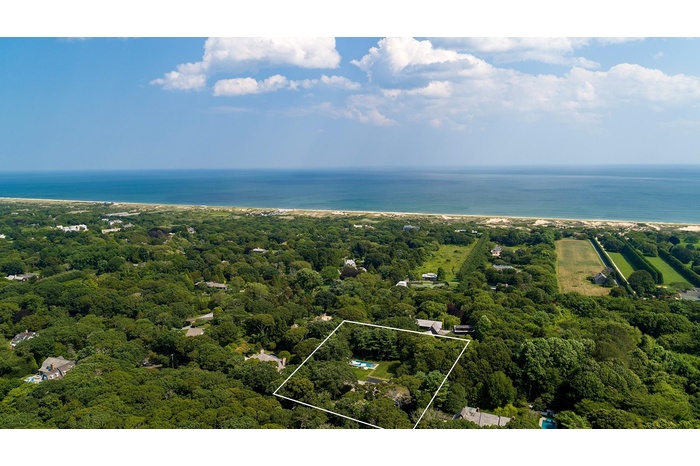 Aerial view of property's location featuring property boundaries highlighted and a large body of water