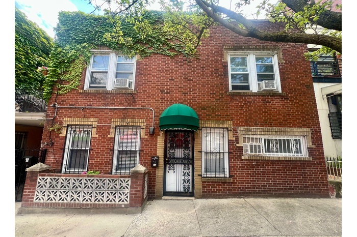 View of front facade featuring brick siding
