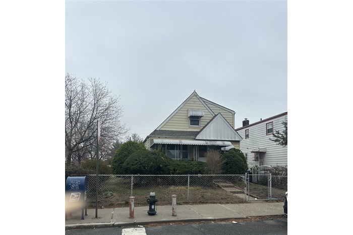 View of front of property with a fenced front yard