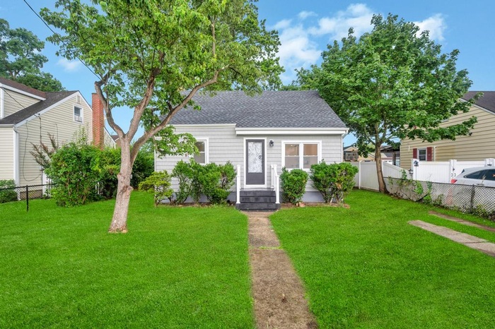 View of front of property featuring roof with shingles