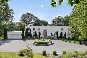 Stunning contemporary masterpiece on Gifford Lake with lavish amenities and serene surroundings.