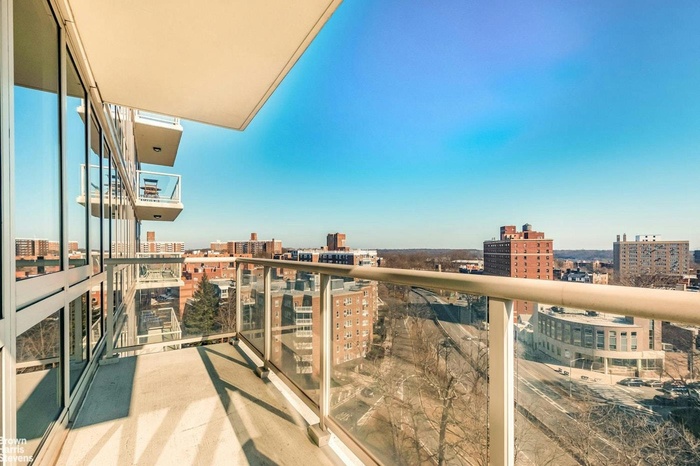 Balcony featuring a view of city