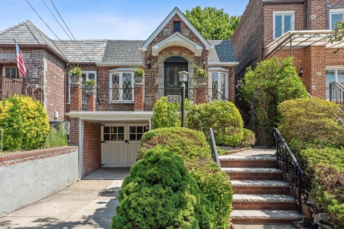 English-style Tudor Red Brick & Fieldstone