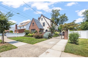 Introducing a fully detached legal two family home situated on a spacious 50 x 100 lot.