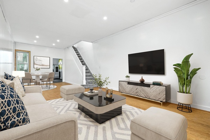 Living area featuring stairway, recessed lighting, crown molding, and wood finished floors