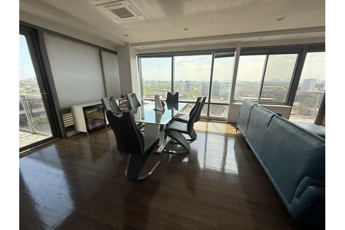 Dining room featuring a view of city and dark wood-type flooring