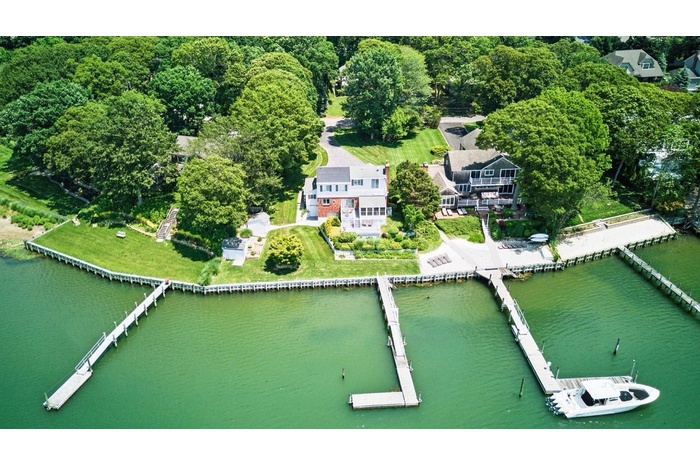 Aerial view of property's location featuring a nearby body of water