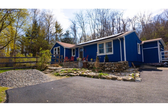 Single story home featuring fence