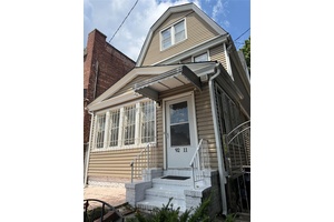 Welcome to this spacious single family home located in the heart of Elmhurst.