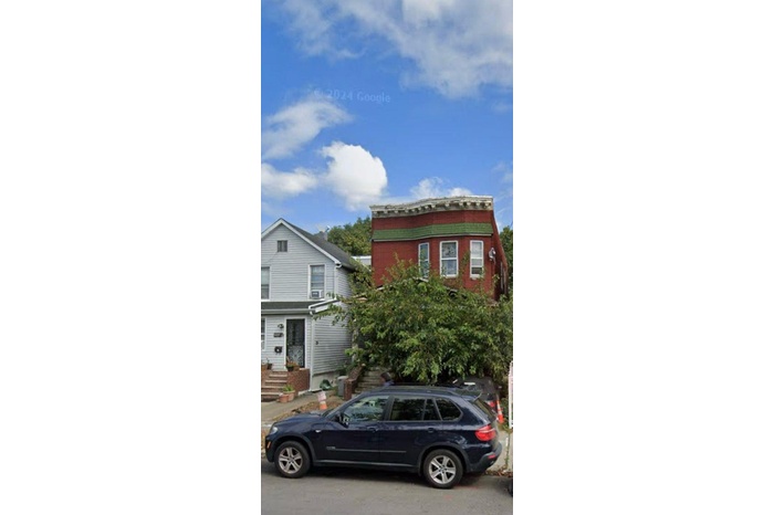 View of front of house with brick siding