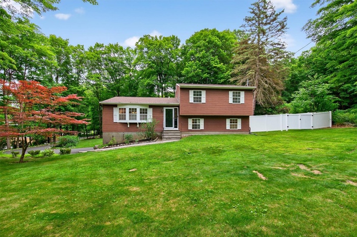 Split level home featuring entry steps