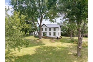 This lovingly restored 1900 farmhouse offers the rare combination of historic character, thoughtful updates, and a setting that ensures lasting privacy.