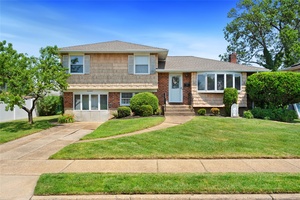 This delightful 4 bedroom, 2 bathroom split level home offers the perfect mix of comfort, charm, and character.