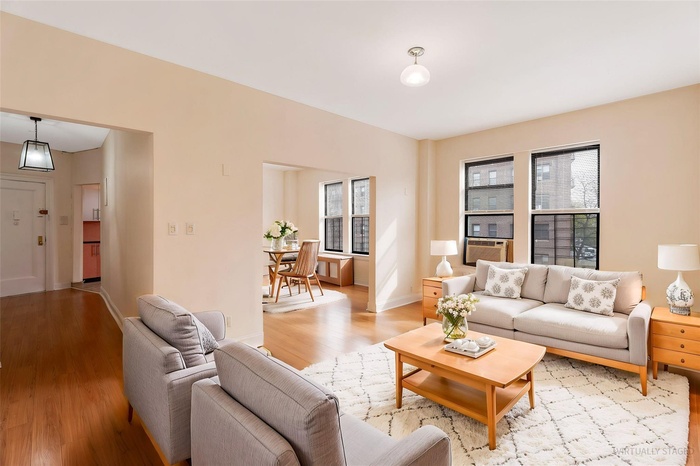 Living area featuring light wood-style flooring and baseboards