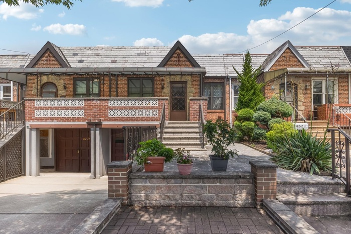 Ranch style brick home with private driveway & garage in front