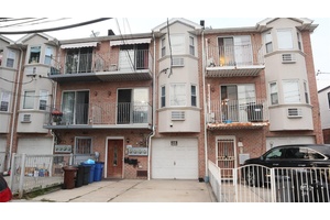 Discover exceptional income potential at this well built 2009 contemporary brick legal 3 family in Ozone Park.