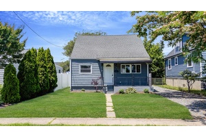 Welcome to this beautifully renovated Cape style home offering the perfect blend of classic charm and modern updates.