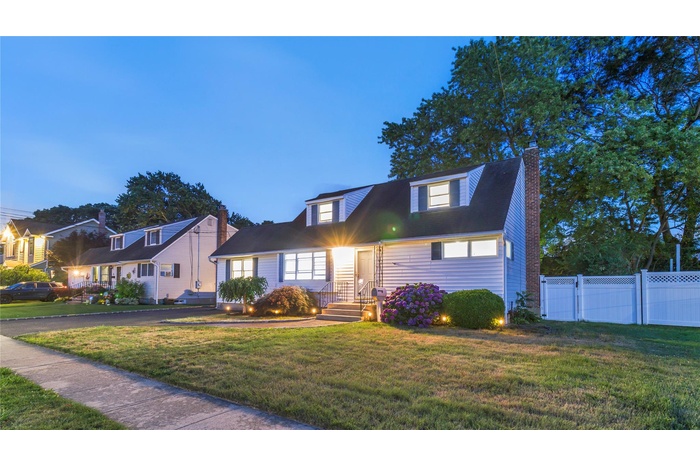 Cape cod-style house with a chimney