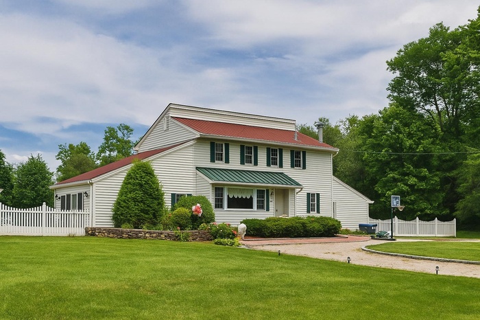 View of front of property with a metal roof