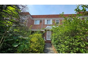 This solid brick attached home offers the perfect canvas to create your dream residence.