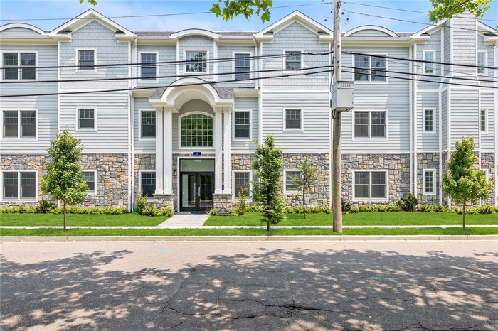 View of front of property with stone siding