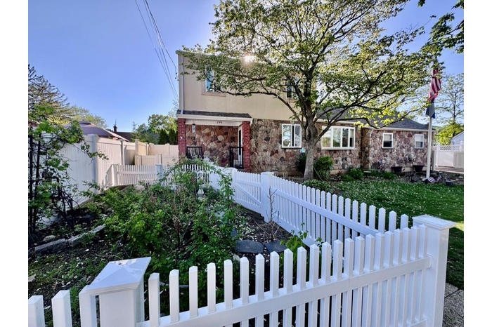 View of front of property with stone siding