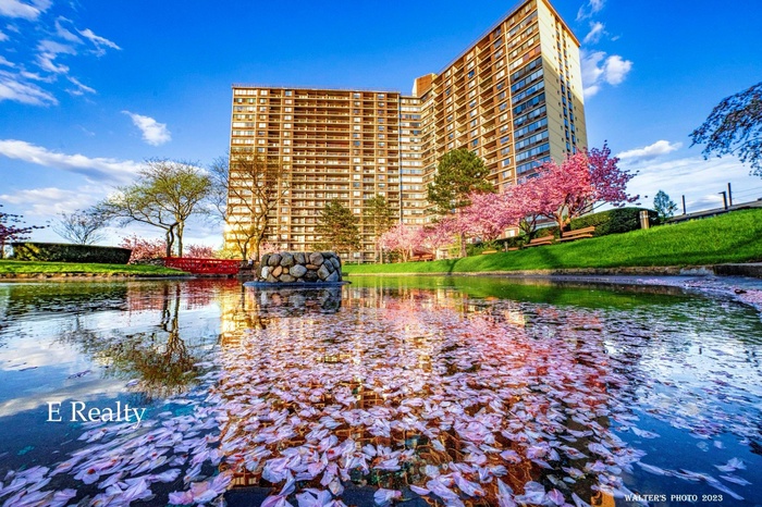 View of property with a water view