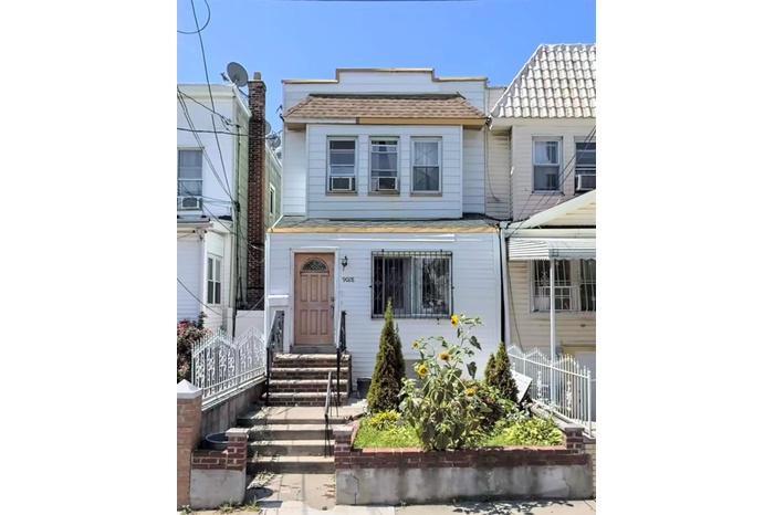 View of front of house featuring roof with shingles, entry steps, and mansard roof