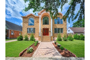 This beautifully reimagined custom brick home with soaring columns offers luxurious living with modern updates from the ground up, situated on a 60x100 lot.