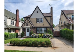 Spacious Brick and Stucco Tudor Colonial situated midblock on beautiful tree lined street within short distance to all that Little Neck has to offer.