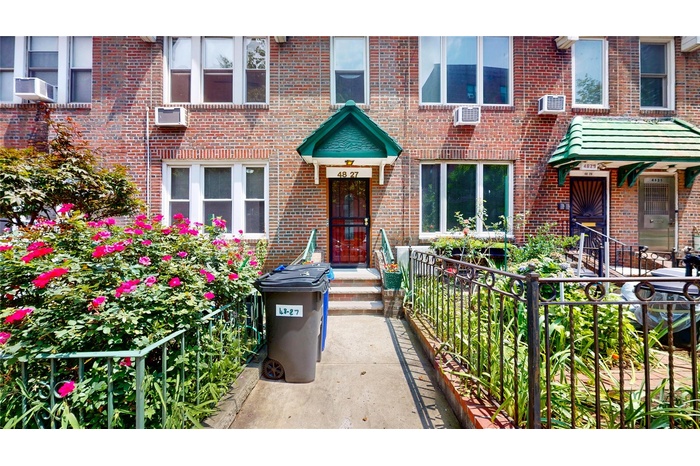 Doorway to property with brick siding