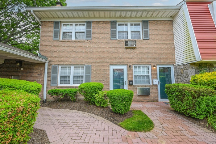 View of front facade featuring brick siding