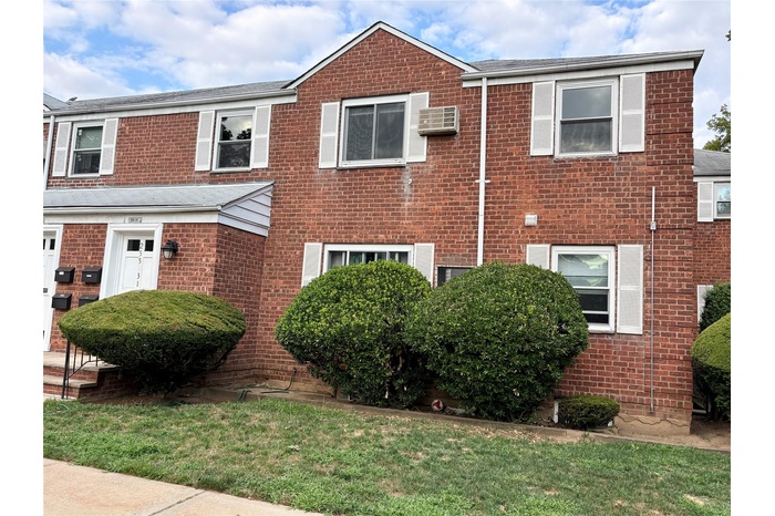View of front of property featuring brick siding