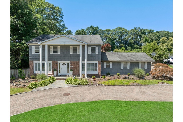 Neoclassical home with brick siding