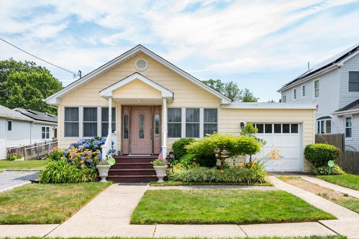 View of front of property with a garage