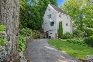 This wonderful 1929 Tudor is situated on a quiet tree lined street.